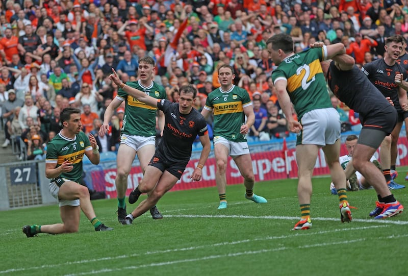 Armagh players celebrate the goal that turned the tie in the second half