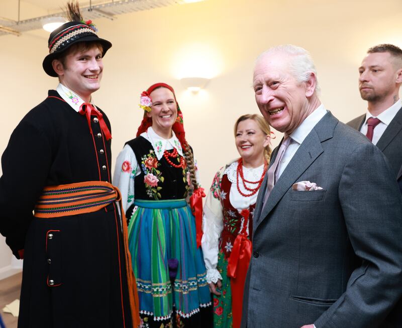 The King met people in traditional dress during his visit