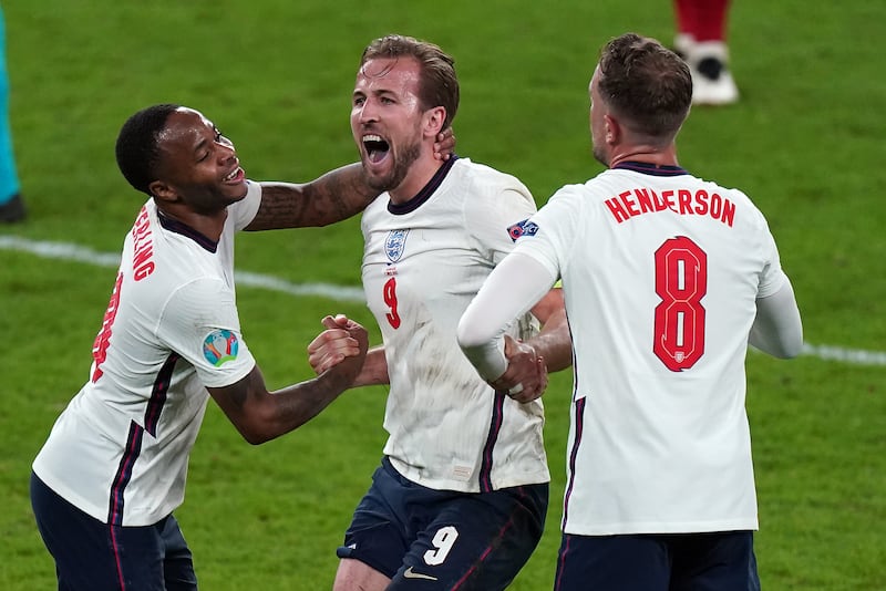 England’s Raheem Sterling, Harry Kane and Jordan Henderson celebrate winning the Euro 2020 semi-final match at Wembley Stadium on July 7 2021