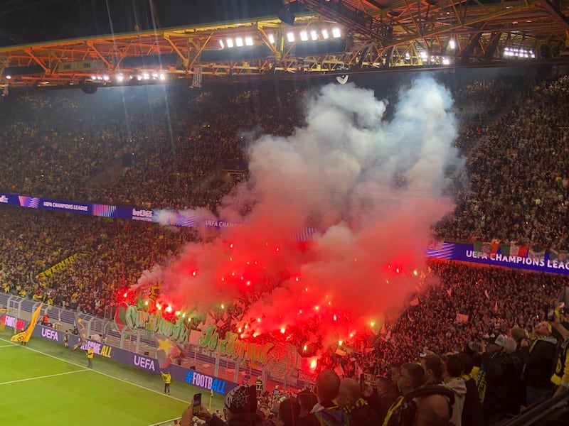 Celtic fans with lit flares ahead of the Champions League match in Dortmund