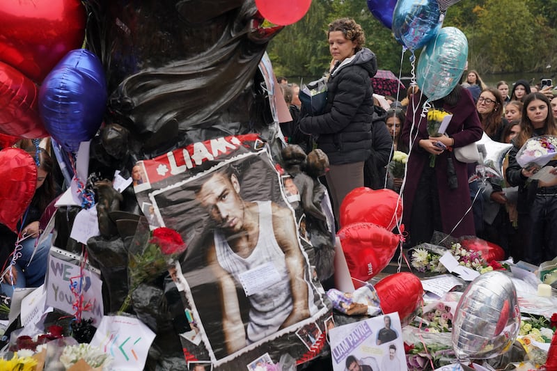 Floral tributes were left as people attended a vigil for 31-year-old One Direction singer Liam Payne at Hyde Park in central London