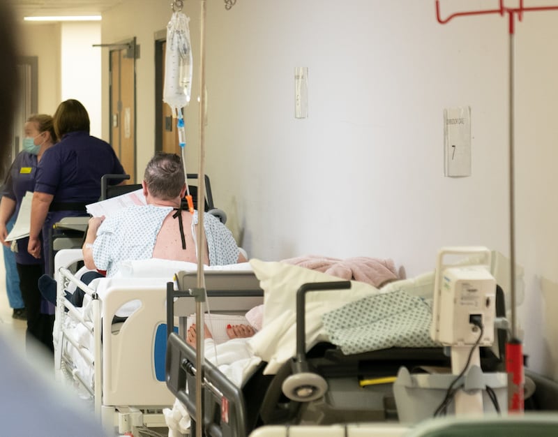 Patients wait on beds in a hospital corridor. PICURE: JOE GIDDENS/PA