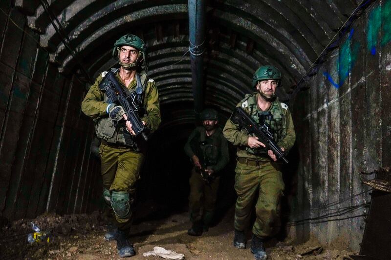 Israeli soldiers seen in a tunnel (AP)