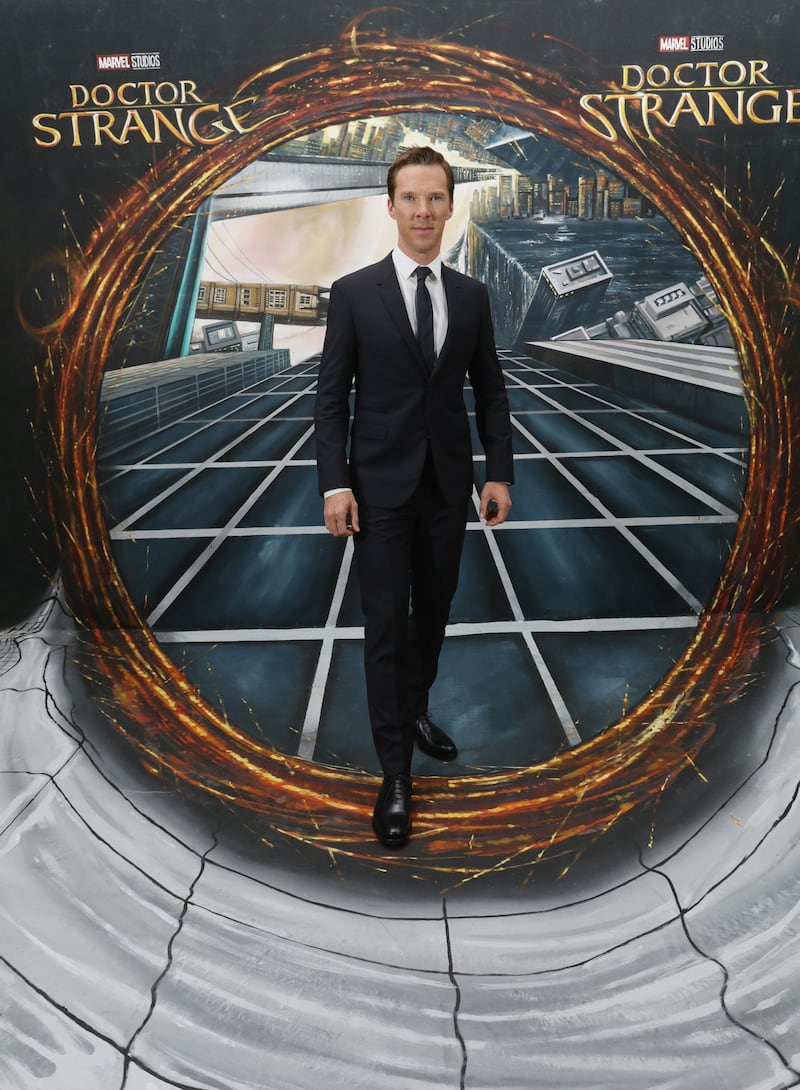 Benedict Cumberbatch poses in front of a Dr Strange-inspired 3D portal artwork in the foyer of the Odeon Leicester Square, London