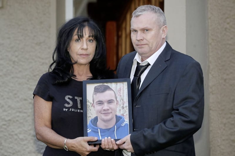 Sandra Kearns holds a photo of her 23-year-old son, Conor, who died suddenly from a suspected accidental drugs overdose. Sandra is pictured alongside Conor&#39;s father, Kevin. Photo: Declan Roughan 