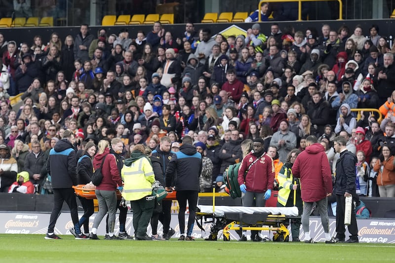 Maanum left the pitch on a stretcher after receiving treatment from medical staff