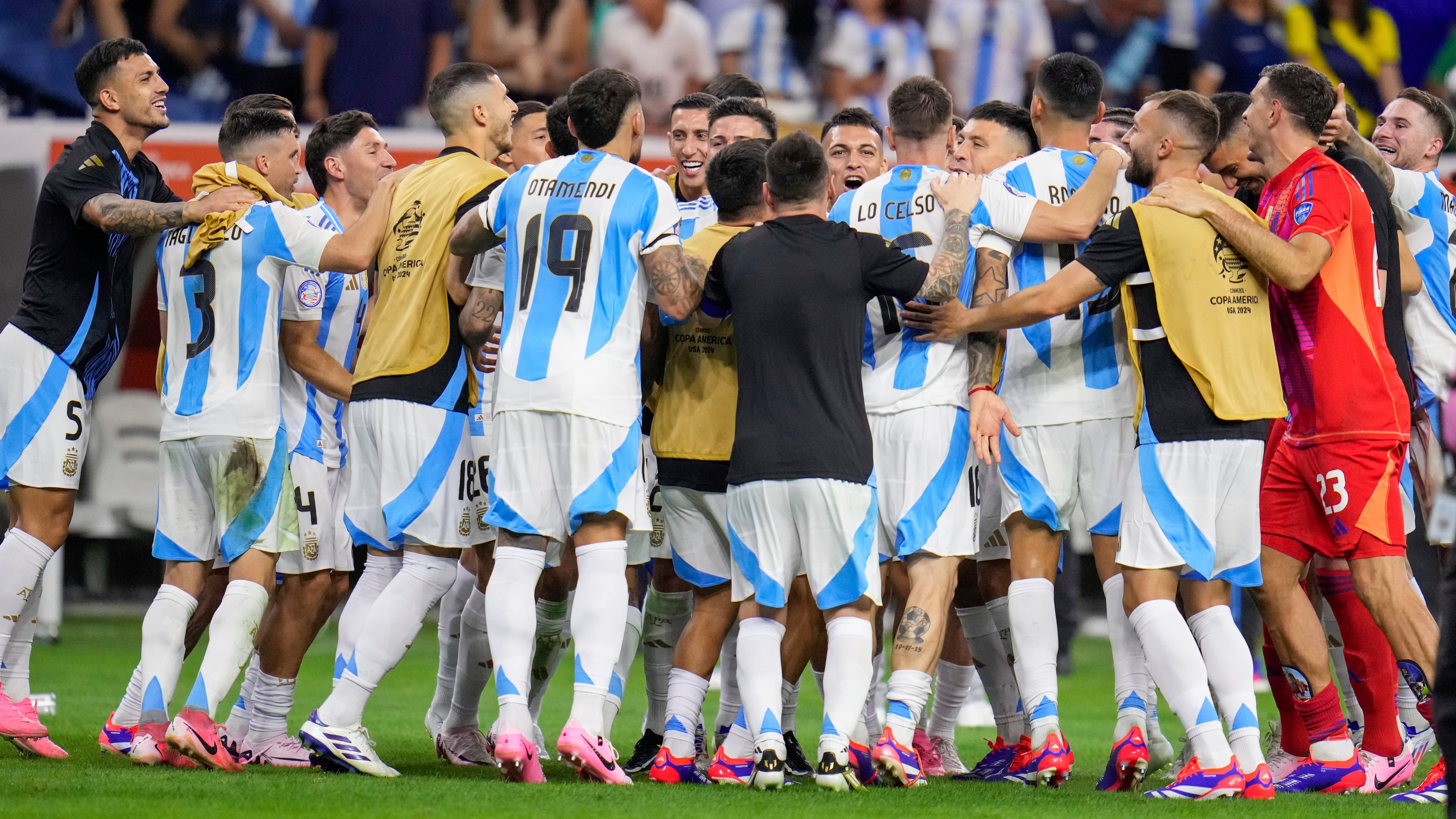 Players of Argentina celebrate defeating Ecuador in a penalty shootout (Julio Cortez/AP)