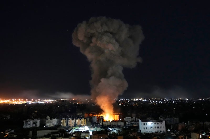 Flames and smoke rise from buildings hit by Israeli airstrikes on Dahiyeh, in the southern suburb of Beirut (Hussein Malla/AP)