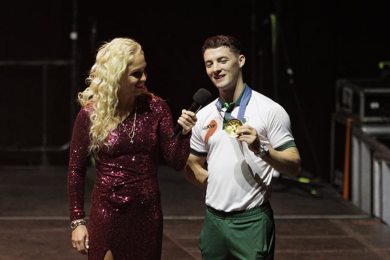 Aimee Fuller (left) interviews Paris 2024 gold medallist Rhys McClenaghan (right) during a homecoming event at the SSE Arena