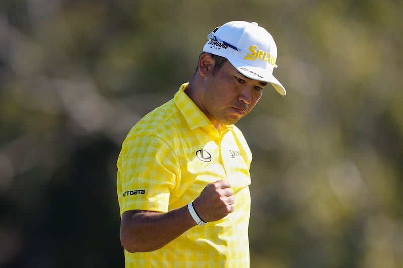 Matsuyama reacts after sinking a putt on the 18th hole to win (Matt York/AP)