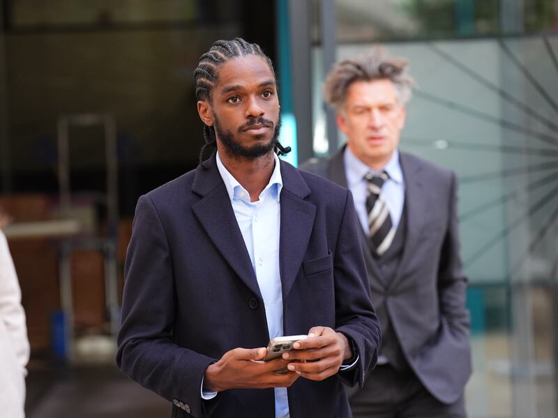 Olympic sprinter Ricardo Dos Santos leaving the International Dispute Resolution Centre in central London