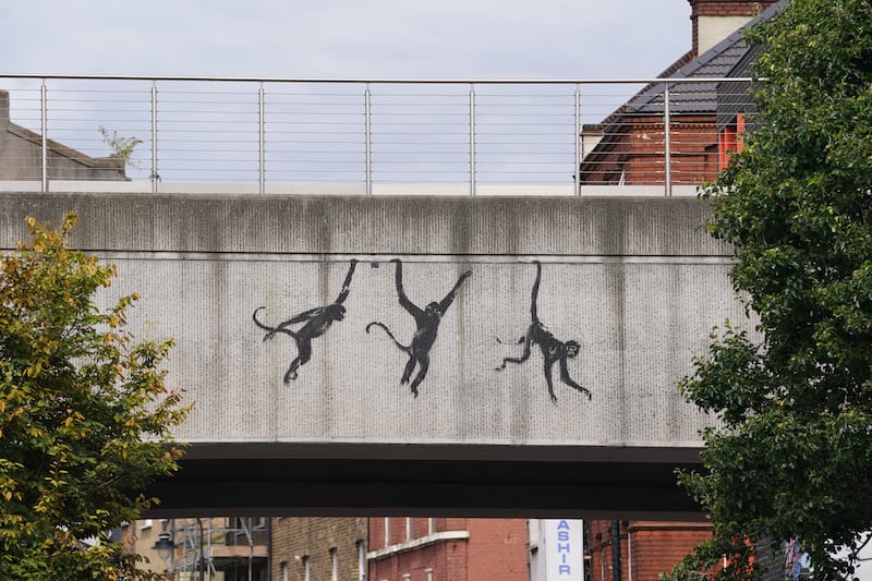 Artwork depicting three monkeys unveiled by Banksy