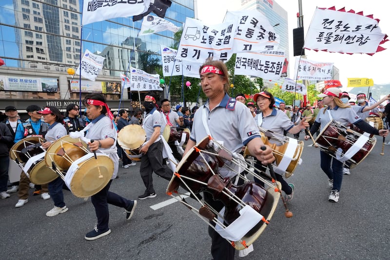 Members of the Korean Confederation of Trade Unions beat their drums during a May Day rally in Seoul (Ahn Young-joon/AP)