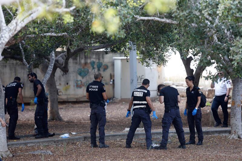 Israeli police inspect the scene of the knife attack (Tomer Appelbaum/AP)