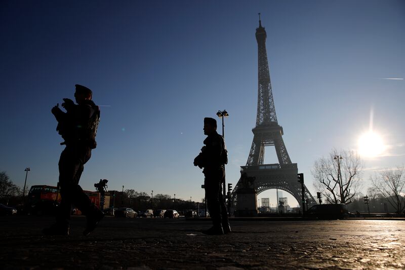Police officers patrol near the Eiffel Tower (AP)