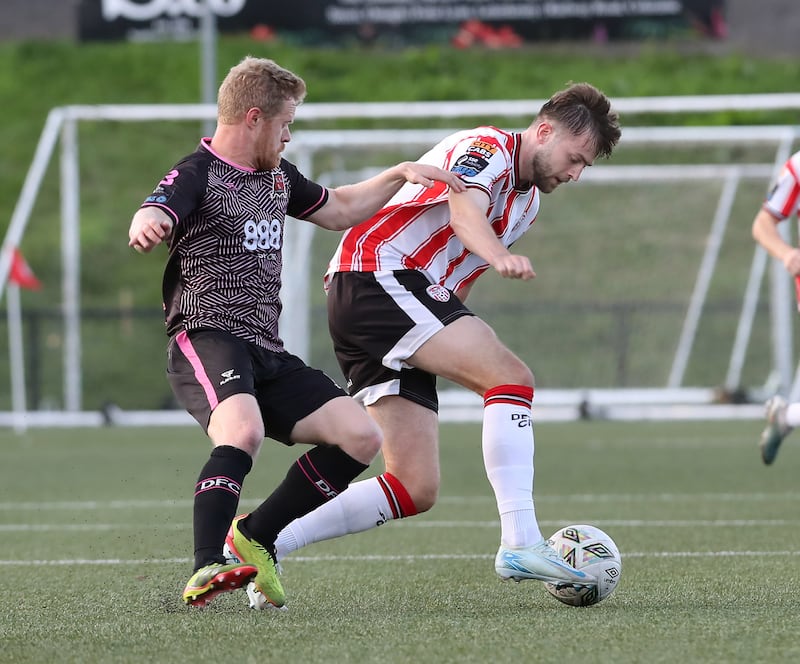 Derry City's Will Patching turning away from Daryl Horgan of Dundalk during the 1-1 draw at the Brandywell. Picture: Margaret McLaughlin