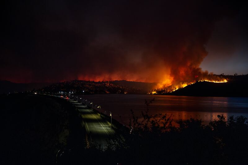 Thousands of people were ordered to evacuate as firefighters tried to keep flames from reaching homes (Stephen Lam/San Francisco Chronicle via AP)