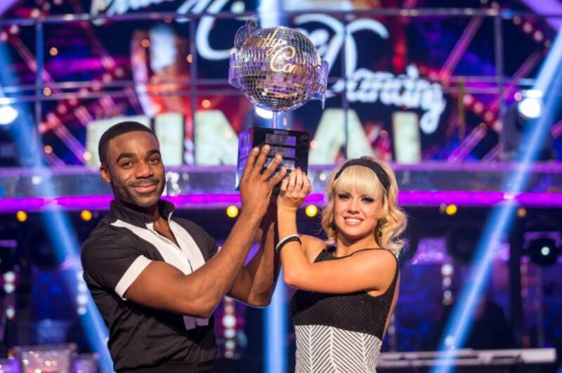 Joanne Clifton and Ore Oduba with the glitterball trophy