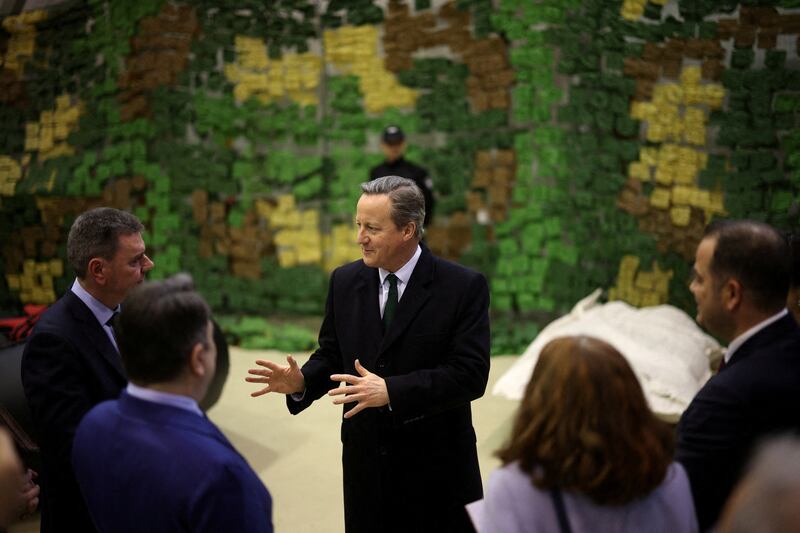 Lord Cameron speaks to Bulgarian officials as he attends a demonstration of Bulgarian customs and border police on fighting illegal migration, in Sofia