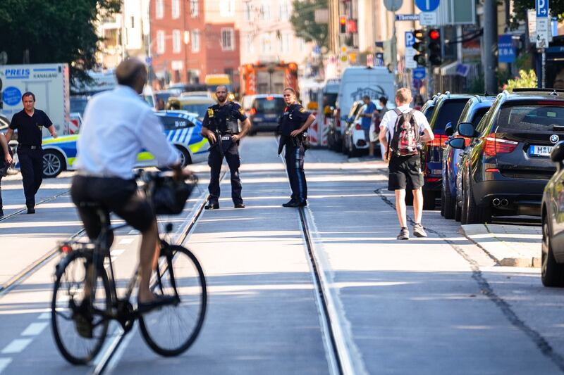 Police officers block a street after the incident in Munich (Matthias Schrader/AP)