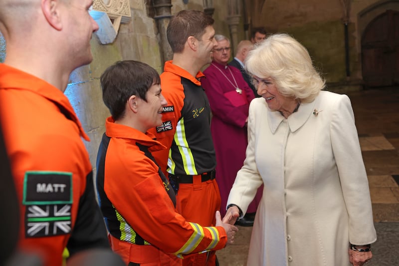 Queen Camilla is greeted by air ambulance charity reps as she attends a musical evening at Salisbury Cathedral in Wiltshire just days after the King’s diagnosis was made public