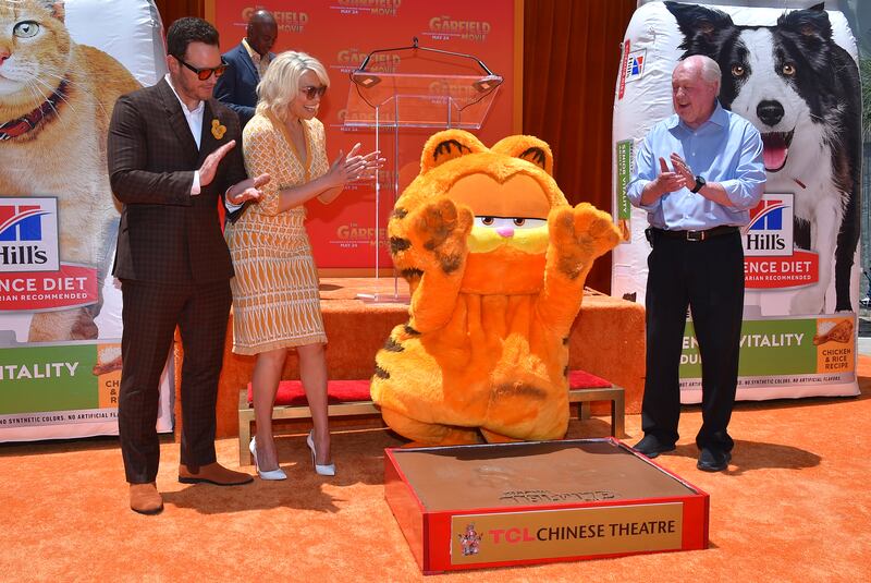 From left, Chris Pratt, Hannah Waddingham, Garfield and Jim Davis attend the premiere of The Garfield Movie (Jordan Strauss/Invision/AP)
