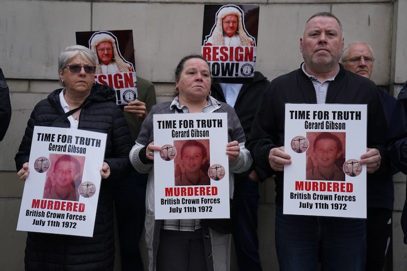 Family members of Troubles victims and their supporters protesting the Legacy Act outside the Court of Appeal at the Royal Courts of Justice in Belfast