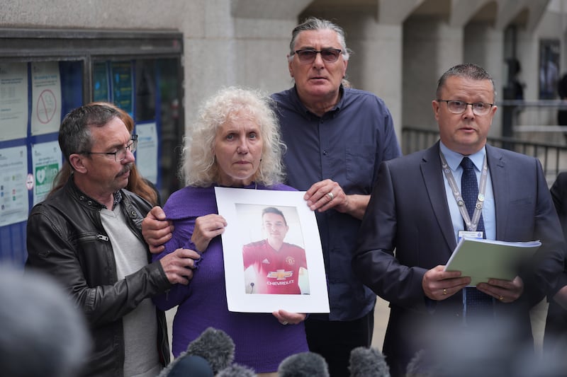 Yvonne Valentine held a picture of her son outside court