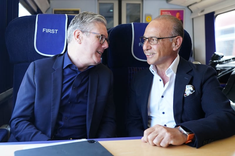 Labour Party leader Sir Keir Starmer with Theo Paphitis travelling to a campaign event in Hampshire
