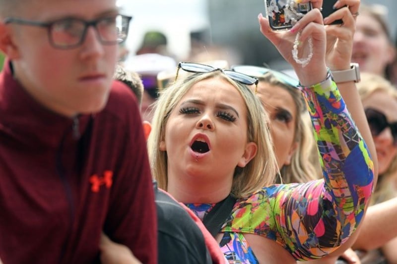 A woman sings along at Trnsmt .