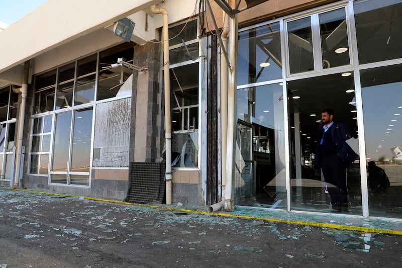 Damaged glass windows in Sana’a International Airport (Osamah Abdulrahman/AP)