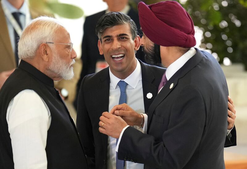 India’s prime minister Narendra Modi, British Prime Minister Rishi Sunak, and President of World Bank, Ajay Banga shared a light moment on day two of the 50th G7 summit (Pool Photo via AP)