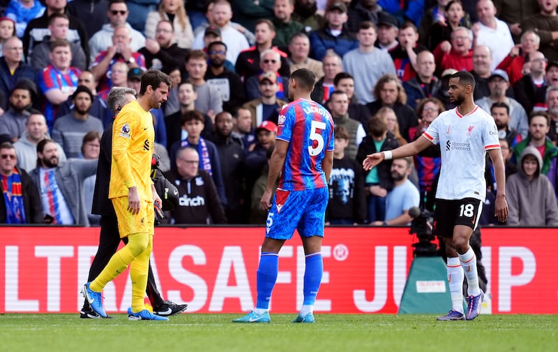 Liverpool goalkeeper Alisson Becker, left, will be sidelined for several weeks