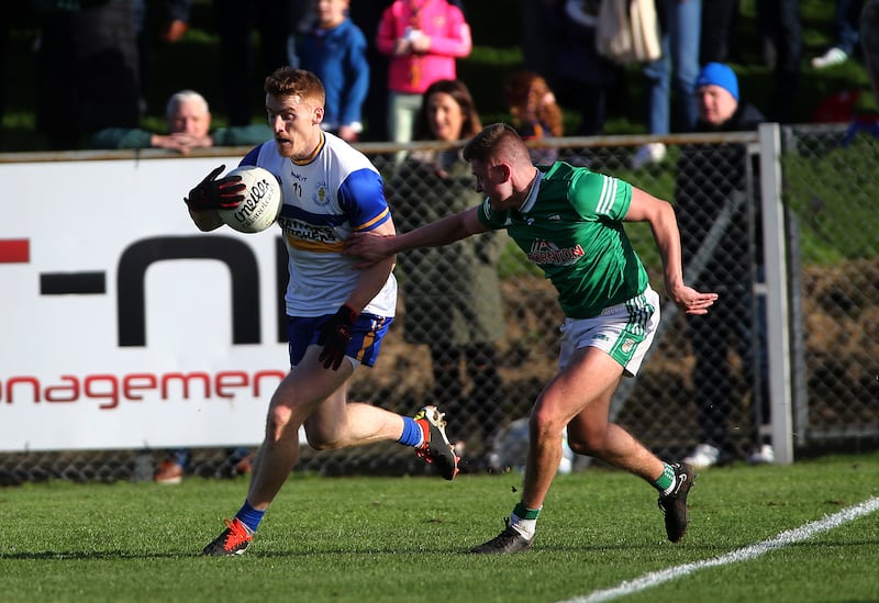 Errigal Ciaran's Peter Harte is challenged by Cargin's Jamie Gribbin.