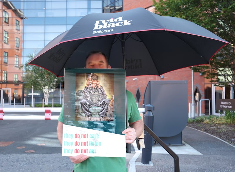 Blue lights protesters outside the policing board office on Thursday.
PICTURE COLM LENAGHAN