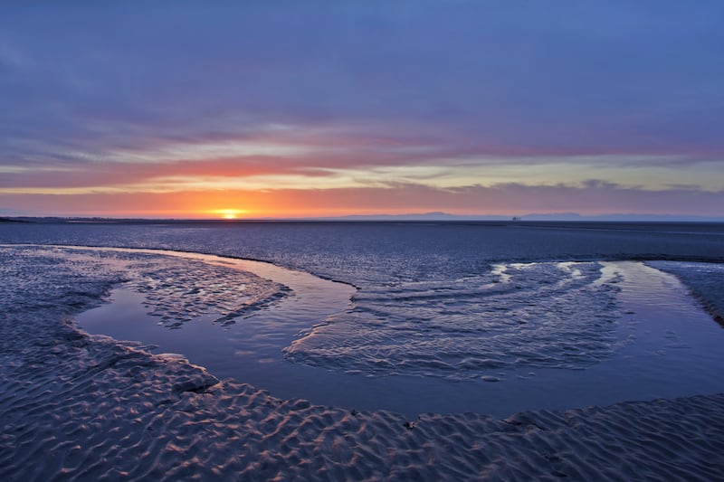 Mudflats at dawn in Solway Firth, Dumfries and Galloway, Scotland