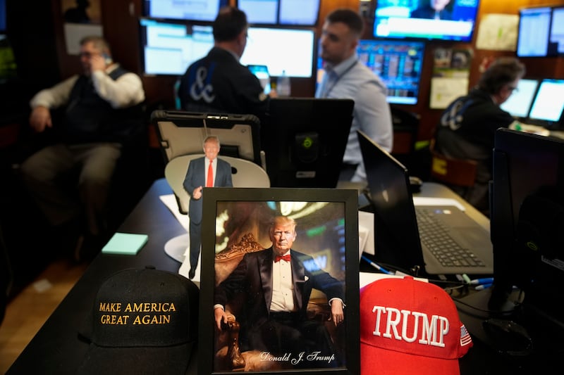 Paraphernalia supporting US President Donald Trump is displayed at a post on the floor of the New York Stock Exchange in New York (Seth Wenig/AP)