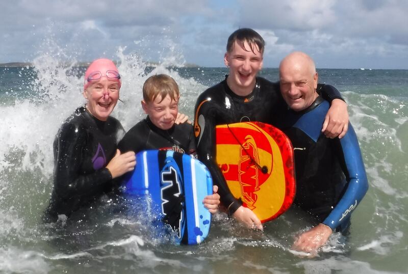 Andrea pictured with her late husband Paddy and their sons Fraser and Alex 