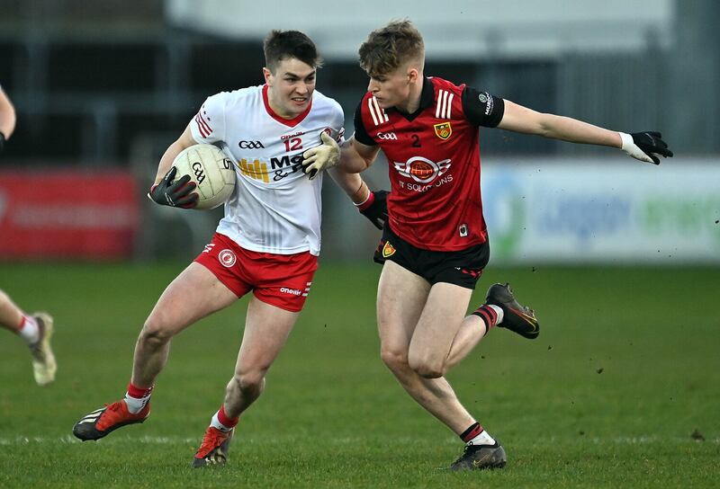 Tyrone's Ruairi Canavan looks to break free of Down's Patrick McCarthy. 