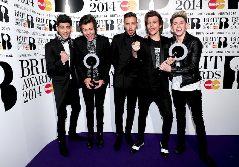 Zayn Malik, Harry Styles, Liam Payne, Louis Tomlinson and Nial Horan from One Direction with their Awards in the press room at the 2014 Brit Awards