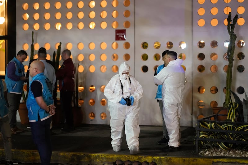 Forensic investigators exit the hotel where former One Direction singer Liam Payne was found dead after falling from a balcony in Buenos Aires, Argentina (Natacha Pisarenko/AP)