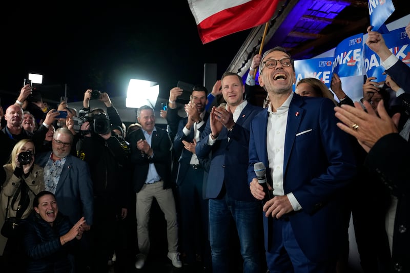 Herbert Kickl, leader of the Freedom Party of Austria celebrates with supporters, in Vienna (Andreea Alexandru/AP)