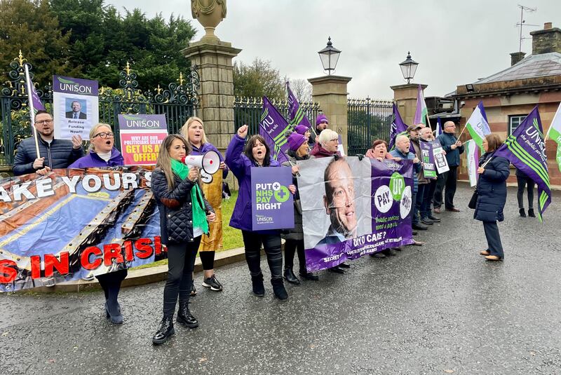 Public sector workers protest over pay outside Hillsborough Castle ahead of talks between Northern Ireland parties and Chris Heaton-Harris (David Young/PA)