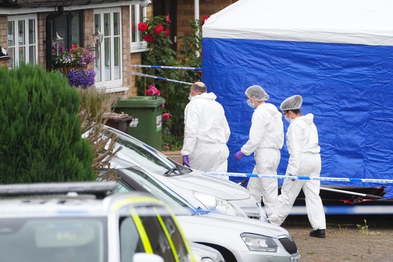 Forensic officers at the scene in Ashlyn Close, Bushey, Hertfordshire