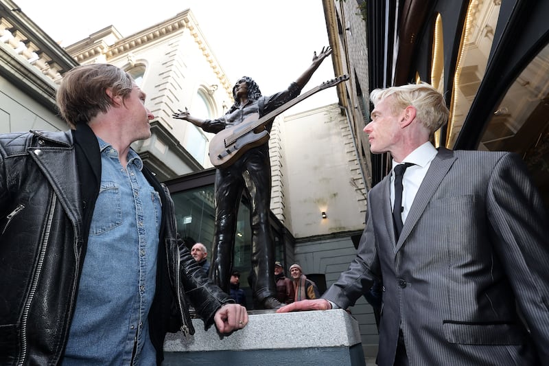 A commemorative statue of legendary composer and musician Rory Gallagher was revealed today at Ulster Hall, honouring his life, music, and his deep connection to Belfast. 
Crafted by renowned sculptors Anto Brennan, Jessica Checkley of Bronze Art Ireland, and David O’Brien of Bronze Art Ireland. It is inspired by a January 1972 Melody Maker magazine cover shot of Rory onstage at Ulster Hall. PICTURE: MAL MCCANN