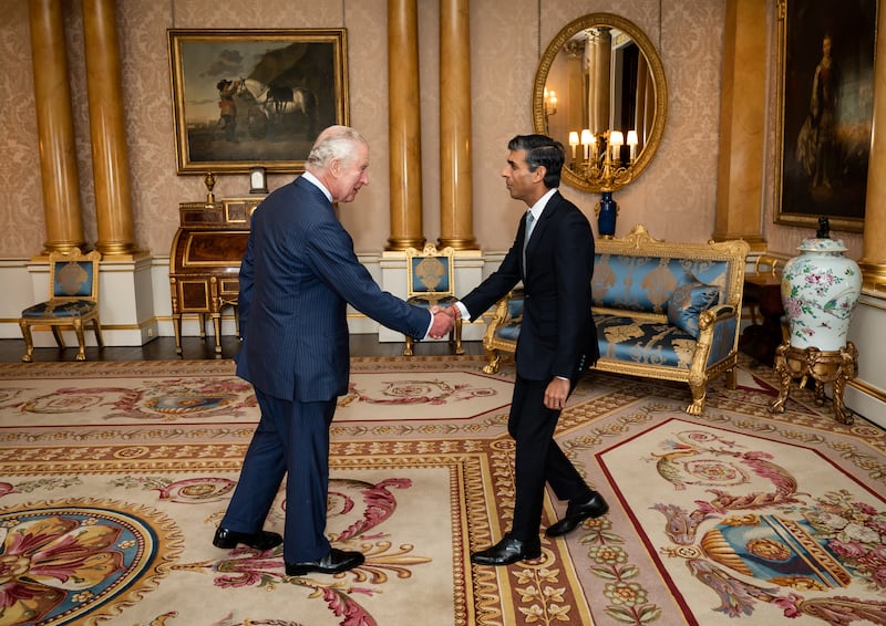 The King shakes hands with Rishi Sunak in 2022 as he invites him to become Prime Minister as the Conservatives’ new leader
