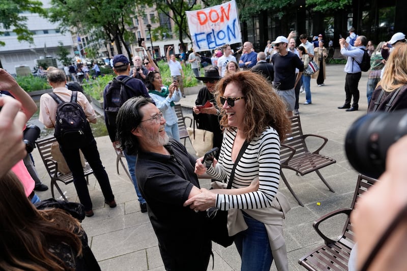 People react to the guilty verdict in New York (Julia Nikhinson/AP)