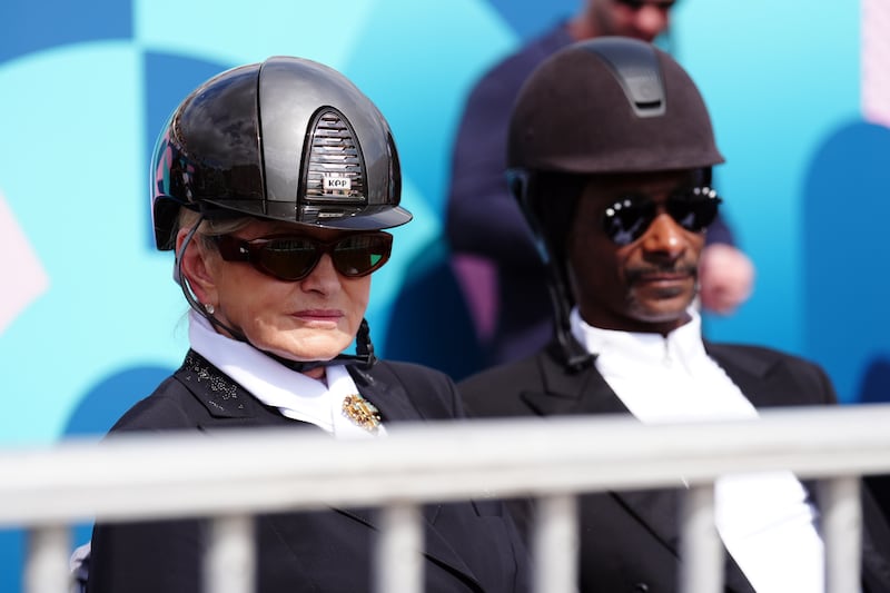 Snoop Dogg and Martha Stewart watching the dressage team grand prix special at the Chateau de Versailles at the 2024 Paris Olympic Games