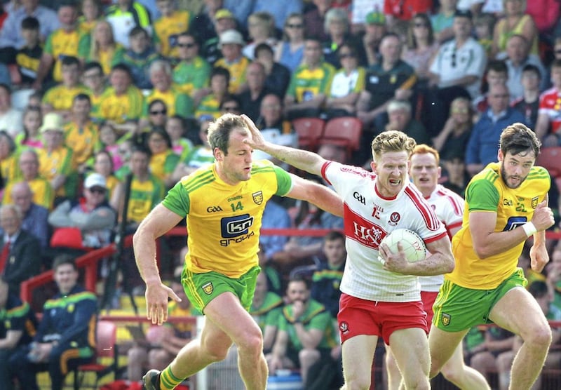 27/05/201: Derry Enda Lynn holds off Michael Murphy and Odhran McNiallais of Donegal during the Ulster Senior Football Championship quarter final at Celtic Park. Picture Margaret McLaughlin. 