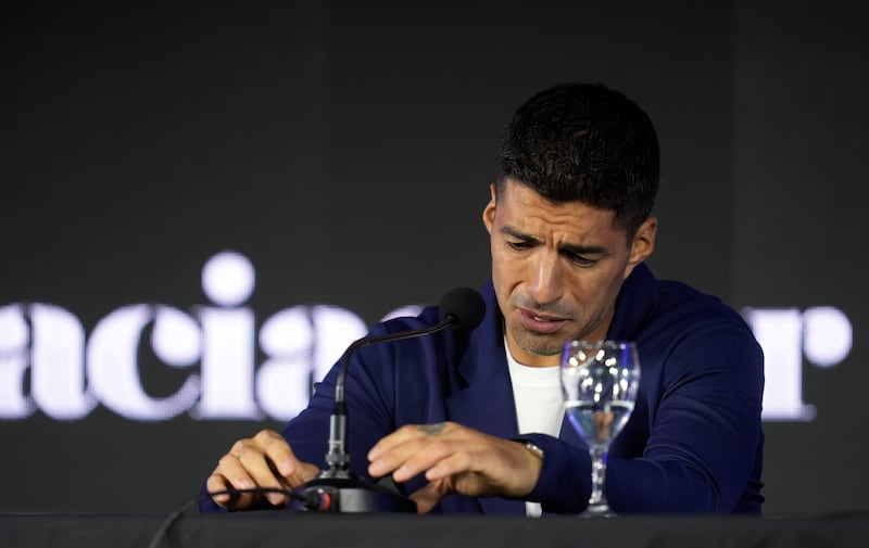 Luis Suarez gave an emotional press conference in Montevideo (Matilde Campodonico/AP)